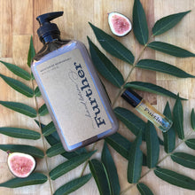 Load image into Gallery viewer, 16 oz hand lotion next to a fragrance stick, on top of leaves with fresh figs