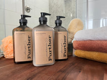 Load image into Gallery viewer, 16oz shampoo, conditioner and shower gel next to s stack of towels